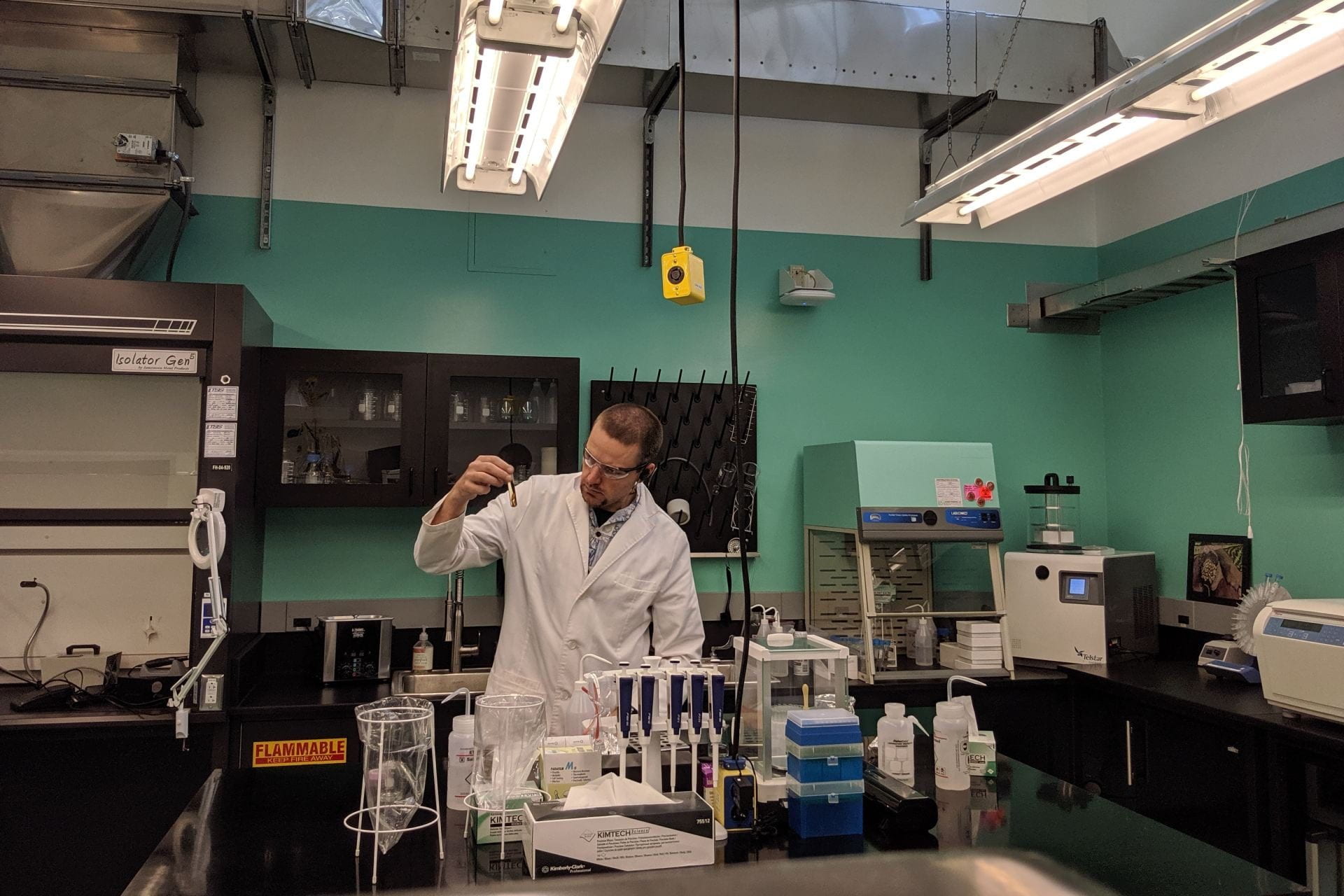 graduate student working in lab setting